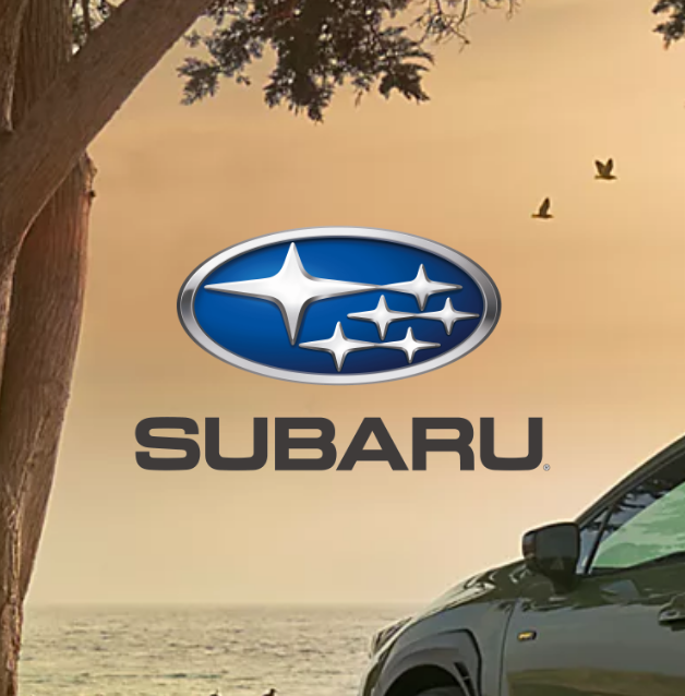 Subaru's logo with a tree and the front part of a Subaru