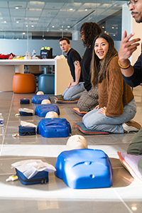 CL employees learning CPR during a session.