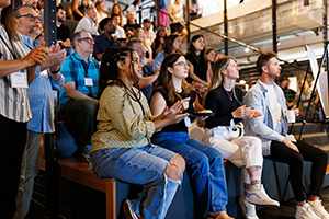 Carmichael Lynch employees sitting on some risers.