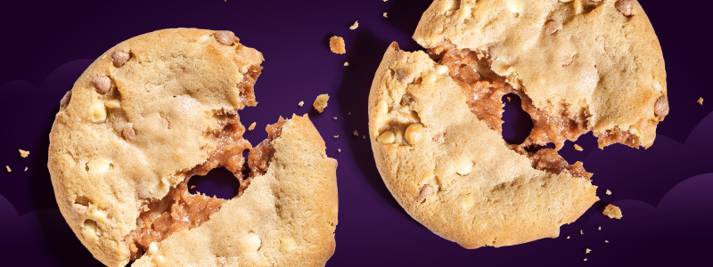 Two cookies broken in half next to each other.