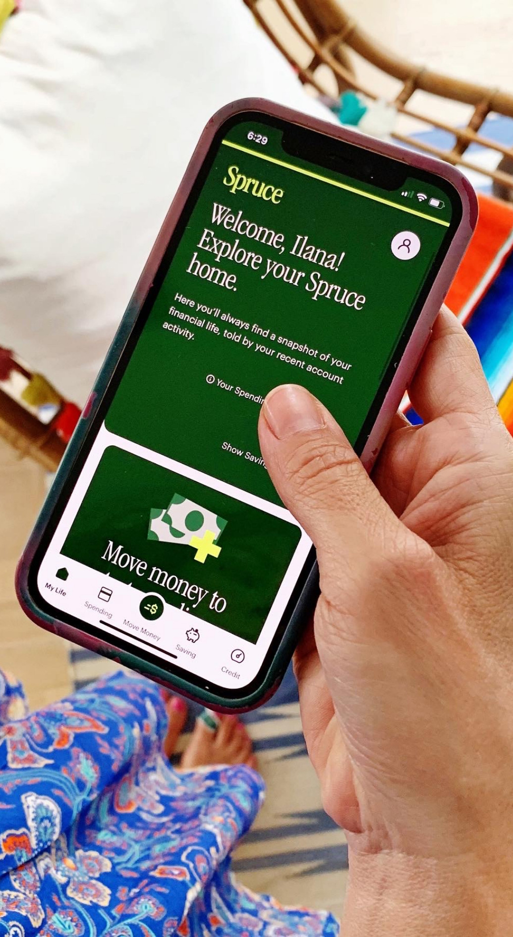 Close up view of the Spruce app on a cell phone.